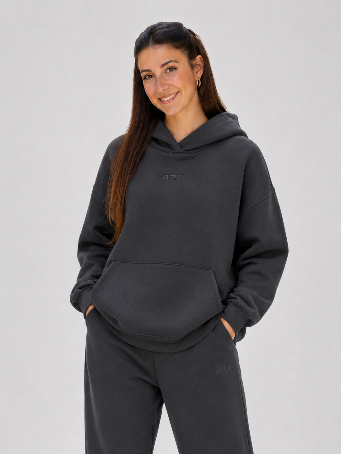 Model wearing charcoal AZA logo hoodie front view